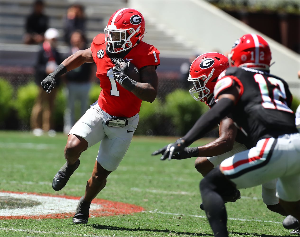 Georgia running back Trevor Etienne makes a long gain during the G-Day game on Saturday, April 13, 2024 in Athens.  Curtis Compton for the Atlanta Journal Constitution