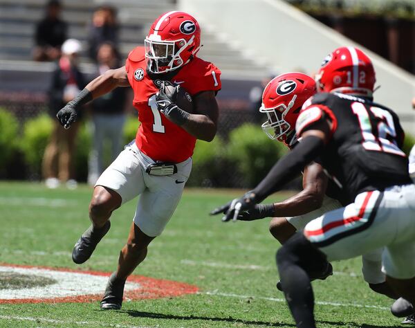 Georgia running back Trevor Etienne makes a long gain during the G-Day game on Saturday, April 13, 2024.  Curtis Compton for the Atlanta Journal Constitution