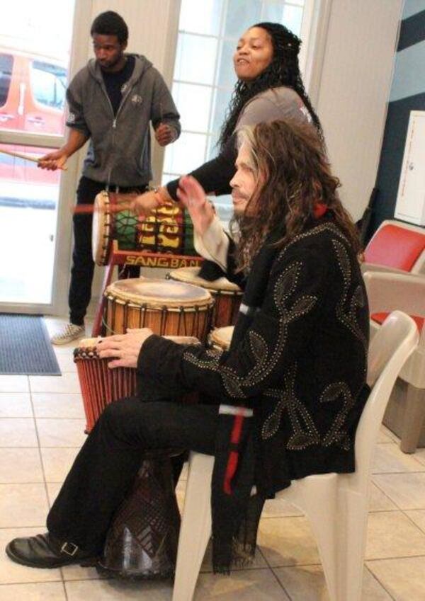 Steven Tyler plays drums with Tatiana Rolles (next to Tyler) and Judah Davis at  Janie’s House on Dec. 6, 2017.   