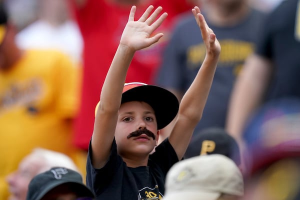 FILE - A baseball fan sports a mustache to support Pittsburgh Pirates starting pitcher Paul Skenes during the first inning of a baseball game against the St. Louis Cardinals Tuesday, July 23, 2024, in Pittsburgh. (AP Photo/Matt Freed, File)