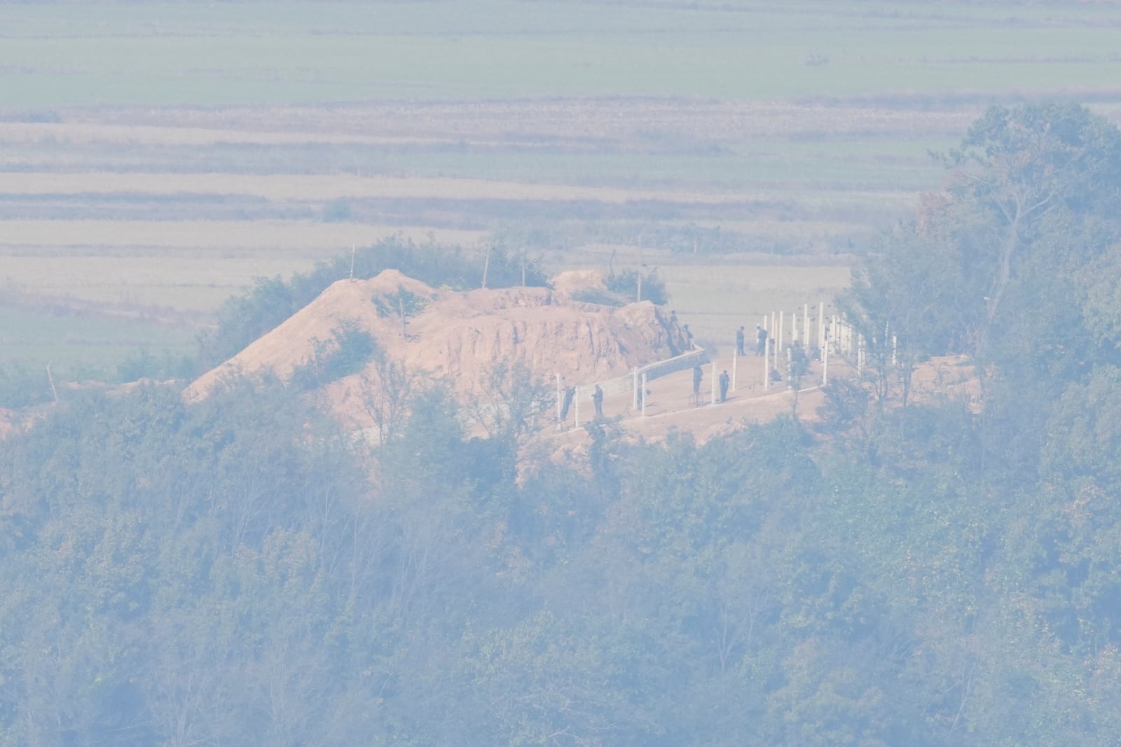 North Korean soldiers are seen from the unification observatory in Paju, South Korea, Thursday, Oct. 31, 2024. (AP Photo/Lee Jin-man)