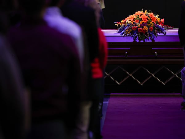 Erin Michelle West's casket sits at the altar of DOXA Church on Monday, Dec. 23, 2024, in Fitchburg, Wis. (Owen Ziliak/Wisconsin State Journal via AP)