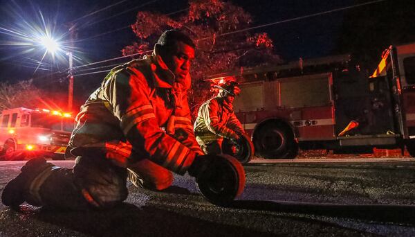 Crews extinguished a blaze that damaged the first floor of a home Friday in northeast Atlanta. JOHN SPINK / JSPINK@AJC.COM