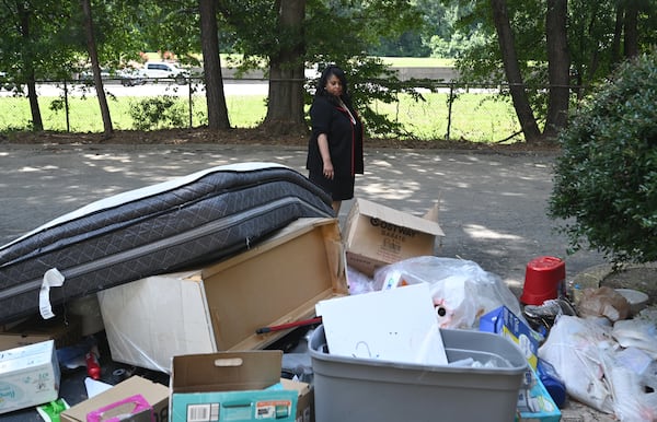 Atlanta City Councilwoman Andrea Boone, who introduced the council  resolution urging a crackdown of negligent landlords, checks conditions  at Vue at Harwell in Atlanta on Friday, July 15, 2022. The Atlanta City Council formally urged law enforcement officials to pursue charges against negligent apartment landlords, in response to an Atlanta Journal-Constitution investigation into complexes beset by crime and housing code violations. (Hyosub Shin / Hyosub.Shin@ajc.com)