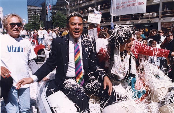 Mayor Andrew Young with his wife ride in the celebratory parade for Atlanta winning the Olympics bid. (AJC 1990) 