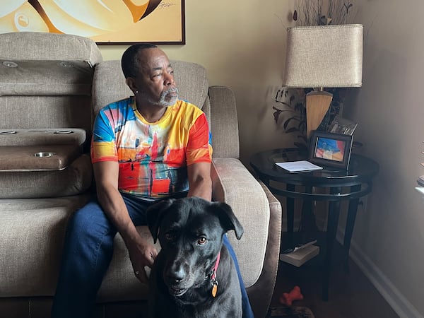 Malcolm Reid at home in Decatur, Georgia, with his dog, Sampson. Reid, who recently marked his 66th birthday and the anniversary of his HIV diagnosis, is part of a growing group of people 50 and older living with the virus. (Sam Whitehead/KFF Health News/TNS)