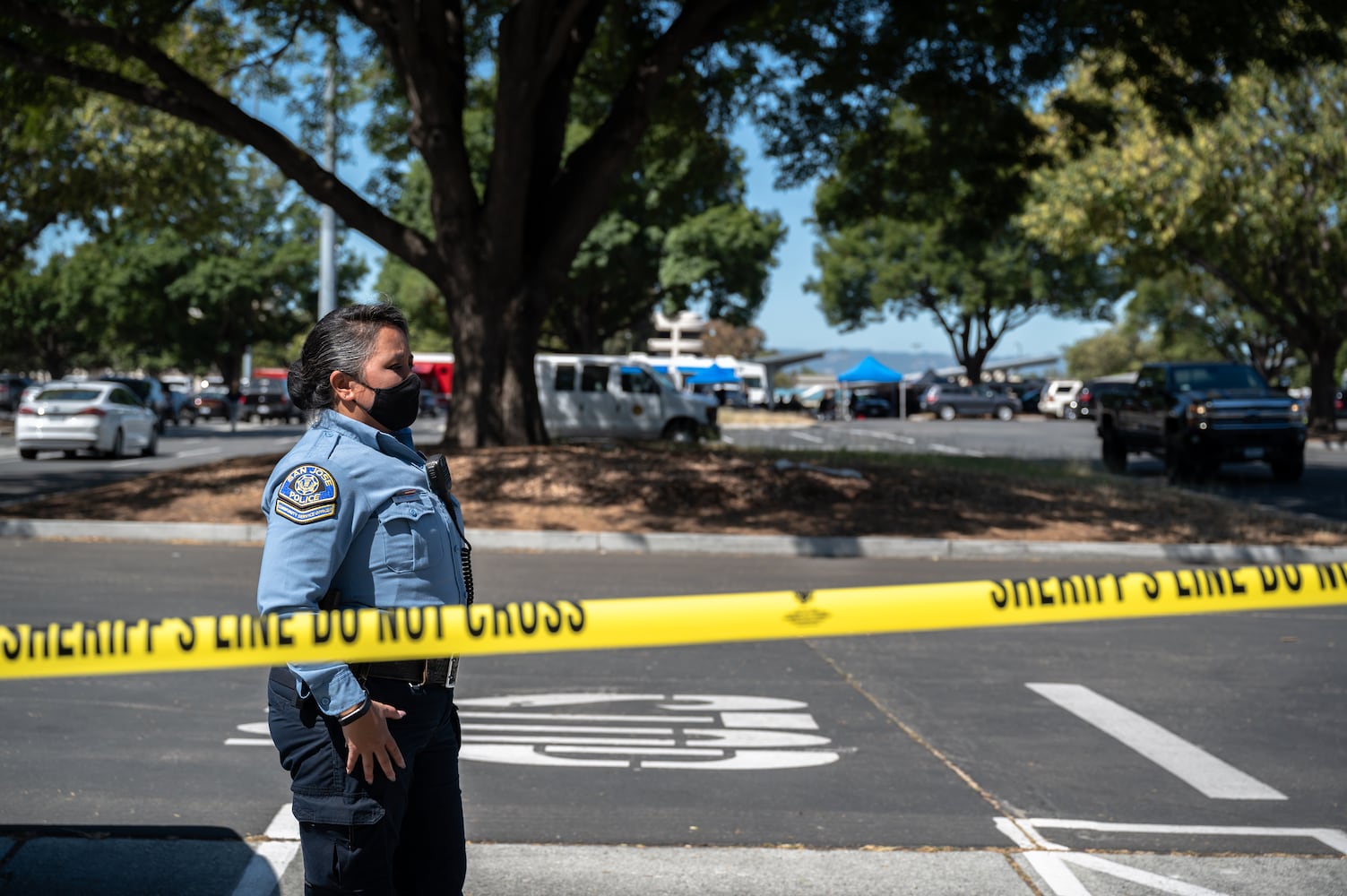 Police officers block off the scene of a mass shooting at the Santa Clara Valley Transportation Authority, in San Jose, Calif., on Wednesday, May 26, 2021. (Mike Kai Chen/The New York Times)