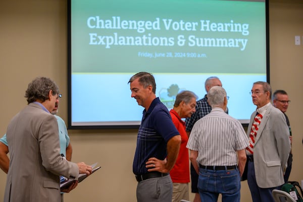 The Forsyth County election board considered challenges to the eligibility of 800 voters in June. County election boards have rejected most voter challenges, including more than 45,000 since July, often citing federal laws that protect voters’ rights against “systematically” removing registrations without detailed evidence. (Jamie Spaar for the AJC)