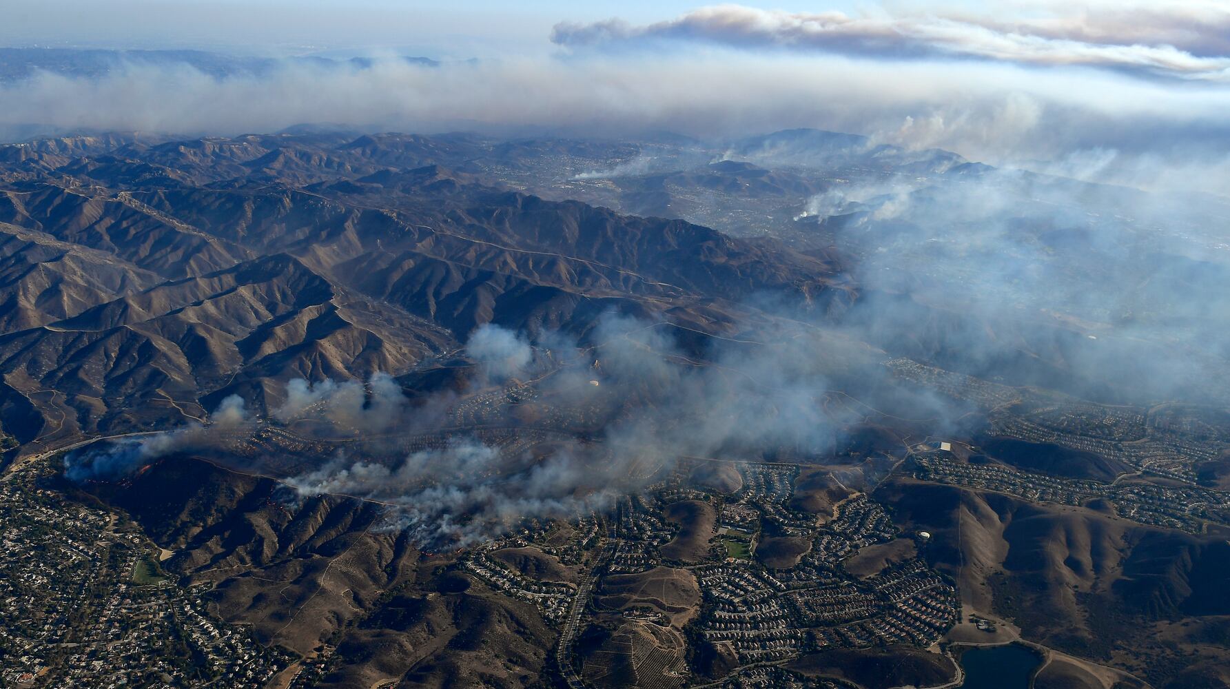 Photos: Deadly wildfires blaze through northern, southern California