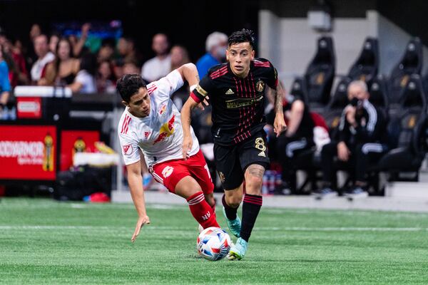 Atlanta United midfielder Ezequiel Barco (8) dribbles against New York Red Bulls Sunday, June 27, 2021, at Mercedes-Benz Stadium in Atlanta. (Dakota Williams/Atlanta United)