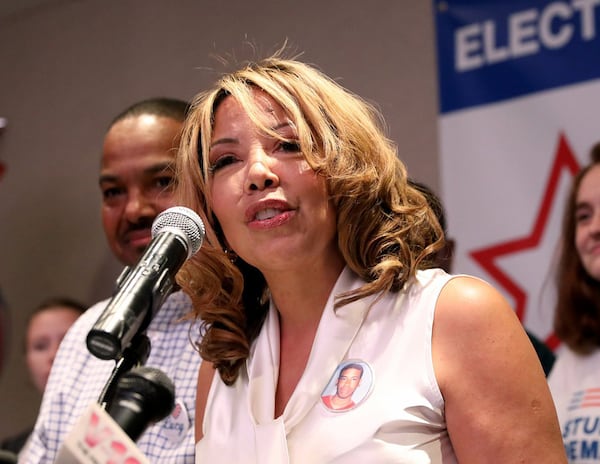 Democrat Lucy McBath speaks to supporters during her watch party Tuesday night as they waited for results in her campaign against U.S. Rep. Karen Handel. The Roswell Republican conceded the race to McBath on Thursday. (JASON GETZ/SPECIAL TO THE AJC)