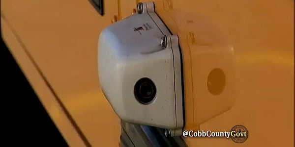 These school bus cameras record drivers illegally zooming back stopped Cobb County school buses. (Cobb County Government)