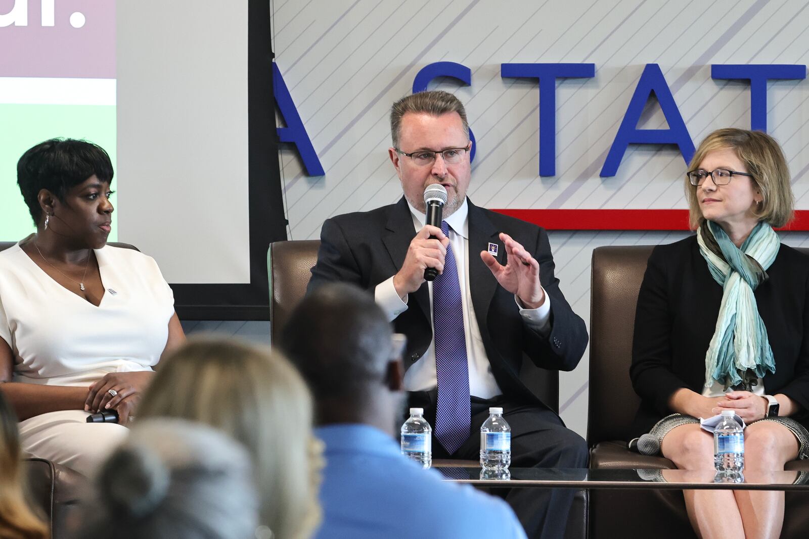 Kevin Tanner (center) spoke about the 988 crisis line at an event Georgia State University in Atlanta last May.