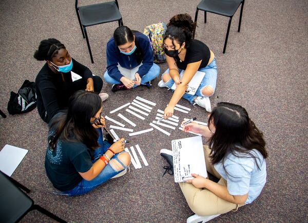 Incoming ninth graders work together to solve a problem during a summer program at McClure Health Science High School on June 24, 2021. STEVE SCHAEFER FOR THE ATLANTA JOURNAL-CONSTITUTION