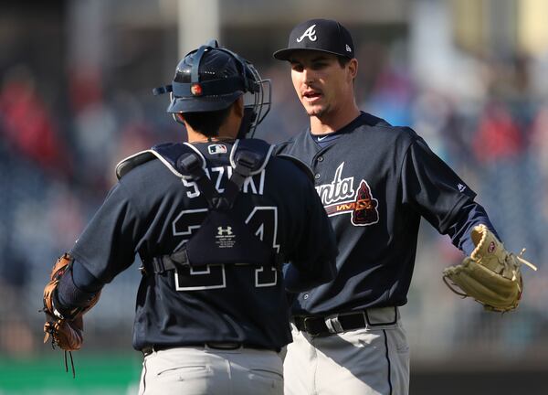 Atlanta Braves relief pitcher Shane Carle (51) celebrates the final out with catcher Kurt Suzuki (24) in the 12th inning of a baseball game against the Washington Nationals at Nationals Park, Wednesday, April 11, 2018 in Washington. Atlanta won 5-3. (AP Photo/Pablo Martinez Monsivais)