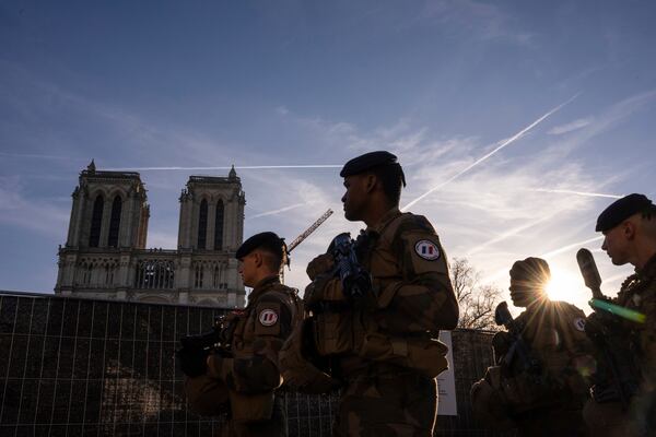 France's anti-terror Sentinelle operation soldiers patrol as French President Emmanuel Macron visits the renovated Notre Dame Cathedral in Paris, Friday, Nov. 29, 2024. (AP Photo/Louise Delmotte)