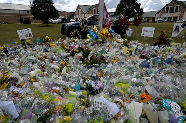 The memorial outside Winder's Apalachee High School, as seen on Thursday, is still growing.