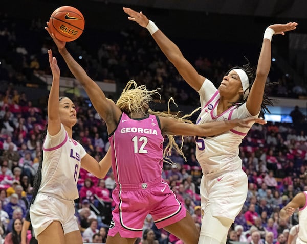 LSU forwards Jersey Wolfenbarger (8) and Sa'Myah Smith (5) defend against Georgia guard Roxane Makolo (12) on the layup attempt during an NCAA college basketball game Thursday, Feb. 20, 2025, in Baton Rouge, La. (Hilary Scheinuk/The Advocate via AP)