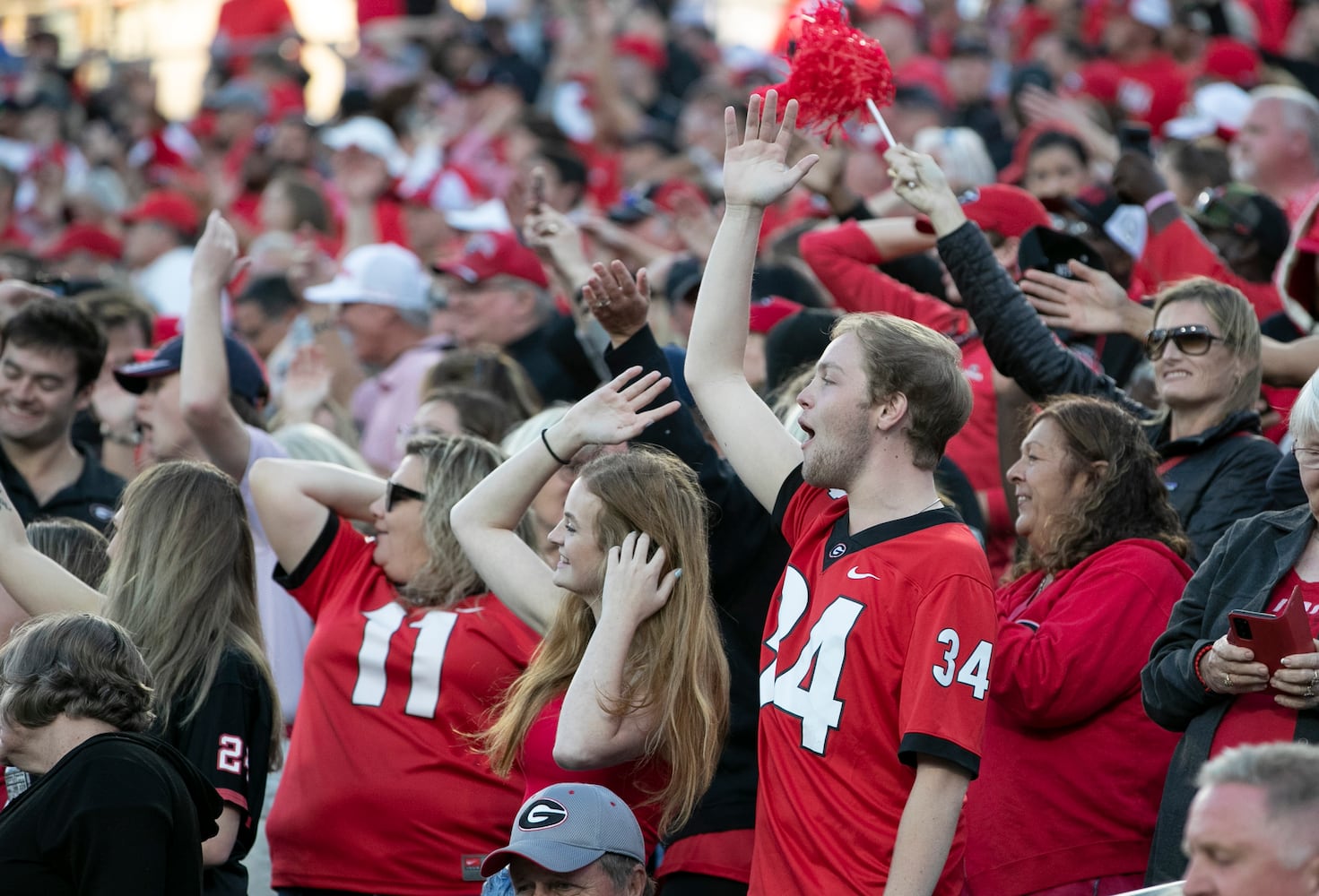 Georgia fans do the Braves chop and chant during the second half of the annual NCAA  Georgia vs Florida game at TIAA Bank Field in Jacksonville. Georgia won 34-7.  Bob Andres / bandres@ajc.com