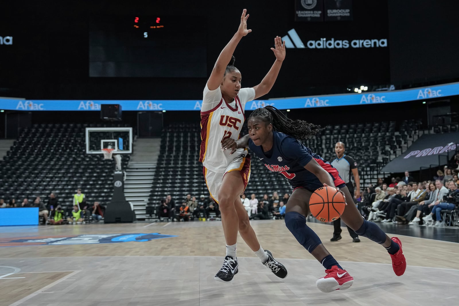 Ole Miss's guard Sira Thienou, right, competes for the ball against USC Trojans's guard Juju Watkins, left, during the basketball match between the University of Southern California (USC) and Ole Miss, Monday, Nov. 4, 2024 in Paris, France. (AP Photo/Aurelien Morissard)