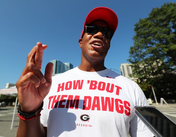 Georgia alumnus Chris Allen, who traveled from L.A., has his fingers crossed for his team outside Bank of America Stadium for the top-5 matchup with No. 3 Clemson and No. 5 Georgia set to face off in the Duke’s Mayo Classic on Friday, Sept 3, 2021, in Charlotte. it will be just the fourth time since 2000 a pair of top-5 teams have met in a season opener in college football. It also will be the highest-ranked meeting ever between the Bulldogs and Tigers, who have played 64 times since their first game in 1897.   “Curtis Compton / Curtis.Compton@ajc.com”