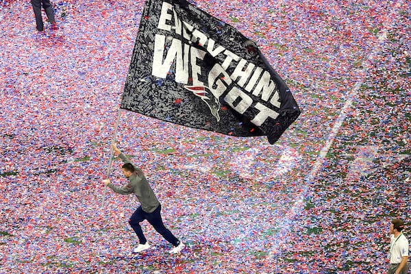 Confetti falls along the field of Mercedes-Benz Stadium after the the New England Patriots beat the Los Angeles Rams, 13-3, during the NFL Super Bowl 53 football game, Sunday, Feb. 3, 2019. (ALYSSA POINTER/ALYSSA.POINTER@AJC.COM)