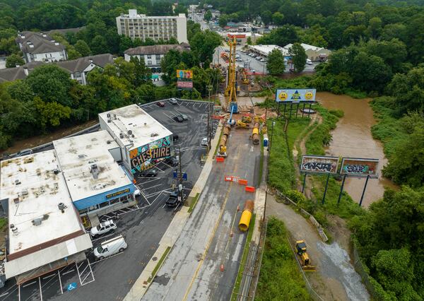 An aerial photograph shows construction along Cheshire Bridge Road at Peachtree Creek, where a bridge was demolished after the fire last year. (Hyosub Shin / Hyosub.Shin@ajc.com)