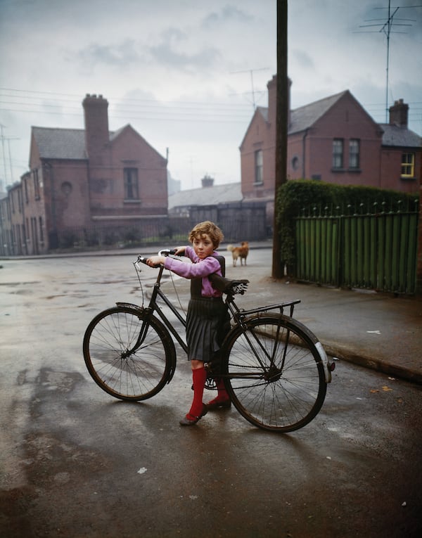 "Bicycle Girl, in the Coombe, Dublin" (1966) by photographer Evelyn Hofer. (Courtesy of High Museum of Art)