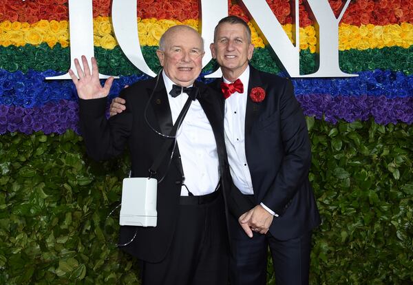 Playwright Terrence McNally, left, and Tom Kirdahy pose at the 73rd annual Tony Awards in New York.  McNally died Tuesday of complications from the coronavirus. He was 81. 