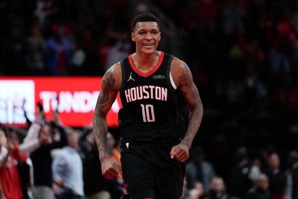 Houston Rockets forward Jabari Smith Jr. reacts after making a 3-pointer during the second half of an Emirates NBA cup tournament quarterfinal basketball game against the Golden State Warriors in Houston, Wednesday, Dec. 11, 2024. (AP Photo/Ashley Landis)