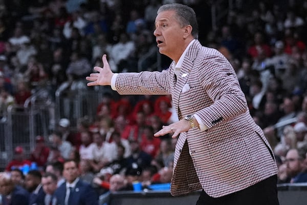 Arkansas head coach John Calipari calls to his players during the first half in the second round of the NCAA college basketball tournament, Saturday, March 22, 2025, in Providence, R.I. (AP Photo/Charles Krupa)