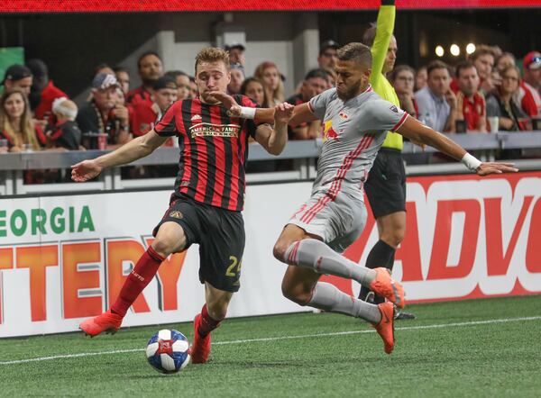 Atlanta United defender Julian Gressel (24) moves the ball past New York Red Bulls defender Amro Tarek (3) during the first half in a MLS game on Sunday, July 7, 2019, in Atlanta. BRANDEN CAMP/SPECIAL