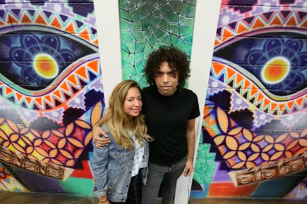 Monica Campana, executive director of Living Walls, The City Speaks and Roberto Hernandez, participating artist of the mural project. Samantha Diaz/MundoHispanico.