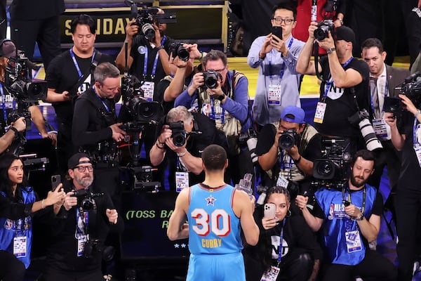 Golden State Warriors guard Stephen Curry poses for photos after the NBA All-Star basketball game Sunday, Feb. 16, 2025, in San Francisco. (AP Photo/Jed Jacobsohn)