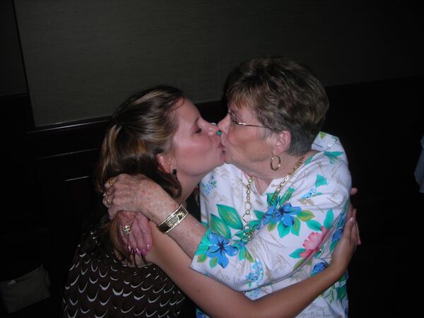 Keri Janton kisses her beloved grandmother, Peggy Hughes, at a family party.
Courtesy of Keri Janton