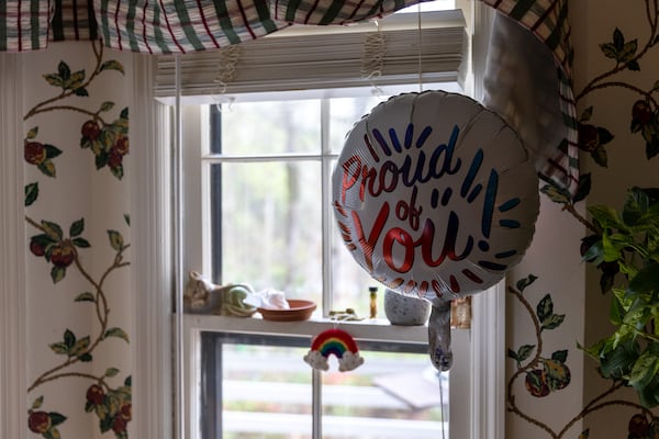 A rainbow decoration and balloon are seen at Michael’s home on Friday, March 10, 2023. (Arvin Temkar / arvin.temkar@ajc.com)