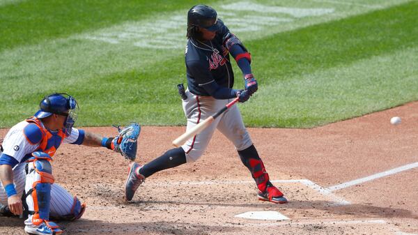 Braves outfielder Ronald Acuna hits a home run against the New York Mets during the sixth inning Sunday, Sept. 20, 2020, in New York. (Noah K. Murray/AP)