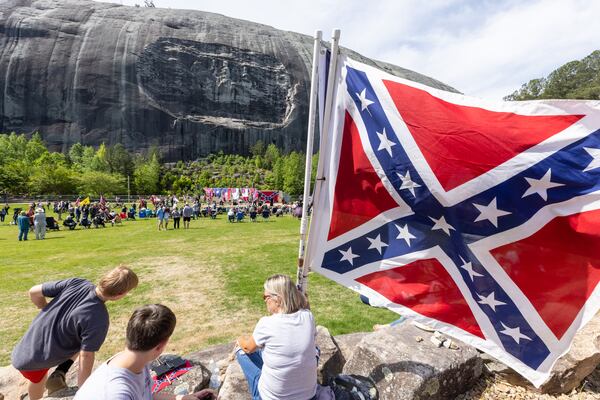 Participants wait for the speakers to start during the Confederate Memorial Day celebration in Stone Mountain Park Saturday, April 29, 23.   (Steve Schaefer/steve.schaefer@ajc.com)