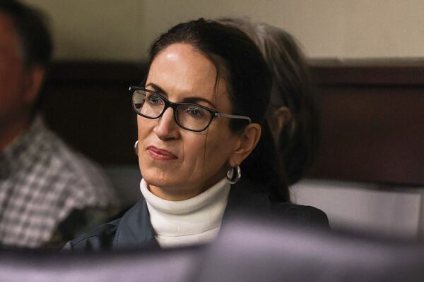 Plaintiff Catherine Floam looks on as attorneys speak during a lawsuit hearing in the Cobb Board of Commissioners redistricting case at Cobb County Superior Court on Monday, Nov. 20, 2023. (Natrice Miller/ Natrice.miller@ajc.com)