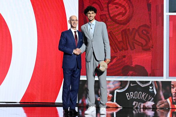 Zaccharie Risacher poses with NBA commissioner Adam Silver after being selected first by the Atlanta Hawks in the first round of the 2024 NBA Draft at Barclays Arena on Wednesday, June 26, 2024 in Brooklyn, NY. (Hyosub Shin / AJC)