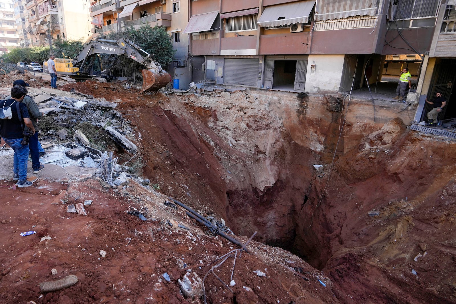 FILE - A hole in the ground near the site of the assassination of Hezbollah leader Hassan Nasrallah in Beirut's southern suburbs, Sunday, Sept. 29, 2024. (AP Photo/Hassan Ammar, File)