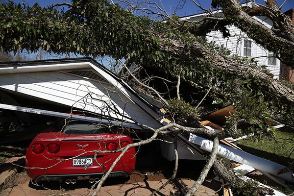 A Chevrolet Corvette sits under rubble that was caused by a tornado March 5 in Smiths Station, Alabama. Numerous tornadoes in Eastern Alabama and Western Georgia on March 3 killed at least 23 people.