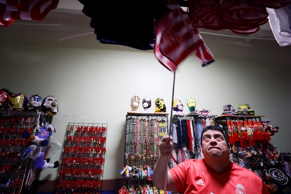 Jose Olague, owner of Olague Sports in Plaza Fiesta on Buford Highway, is seen working on Wednesday, January 29, 2025. Following the immigration arrests that began on Sunday, he reported a 50 percent decrease in sales.
(Miguel Martinez/ AJC)