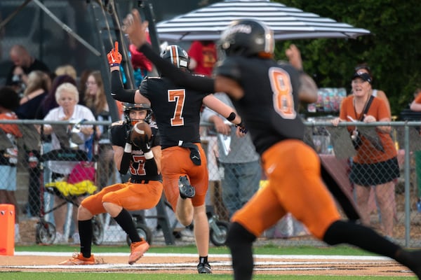 Landon Mayes for Sprayberry makes a touchdown pass during the Kell v Sprayberry football game September 8, 2023. (Jamie Spaar for the Atlanta Journal Constitution)