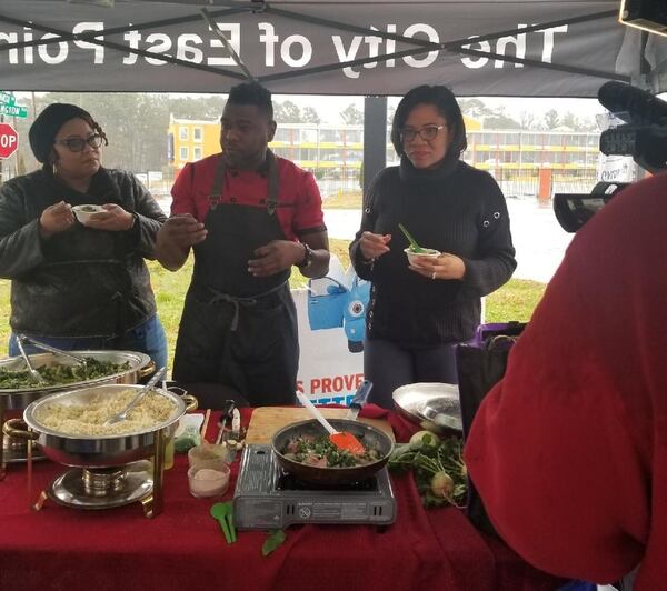 At an East Point Eats Well event, chef Dephon Robinson demonstrates a healthy greens recipe made with collards, onions, garlic and radishes from local farms. CONTRIBUTED BY EAST POINT MAYOR’S OFFICE