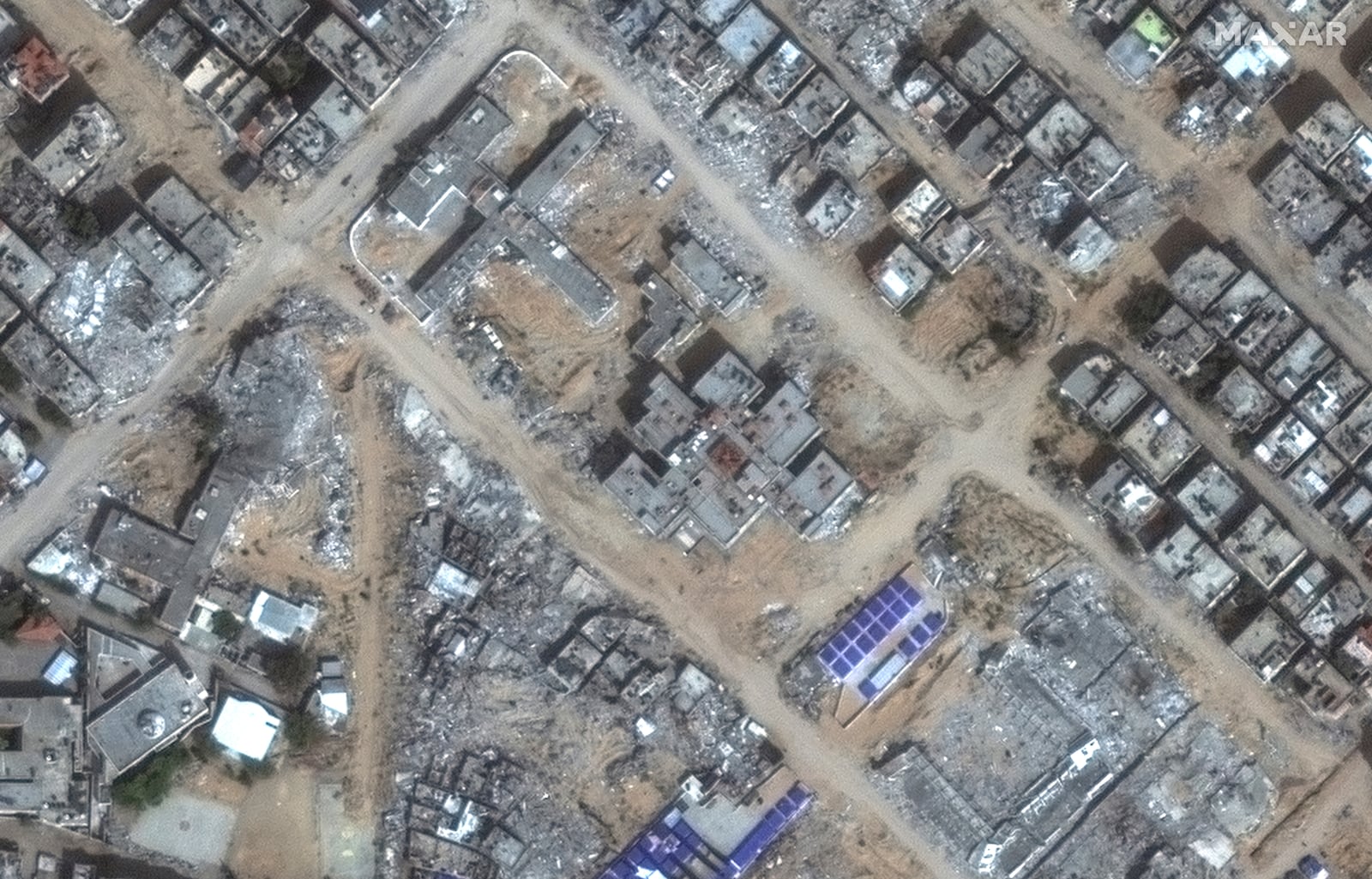 This satellite image released by Maxar Technologies shows damage to al-Nasr Children's Hospital in Gaza City, bottom left, sustained during an Israeli raid in late 2023. (Satellite image ©2024 Maxar Technologies via AP)