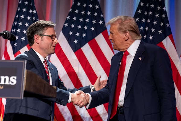 President-elect Donald Trump shakes hands with House Speaker Mike Johnson of La., as he arrives to speak at a meeting with the House GOP conference, Wednesday, Nov. 13, 2024, in Washington. (AP Photo/Alex Brandon)