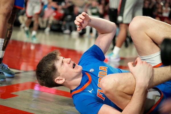 Florida forward Alex Condon (21) reacts after a foul during an NCAA college basketball game against Georgia, Tuesday, Feb. 25, 2025, in Athens, Ga. (AP Photo/Brynn Anderson)