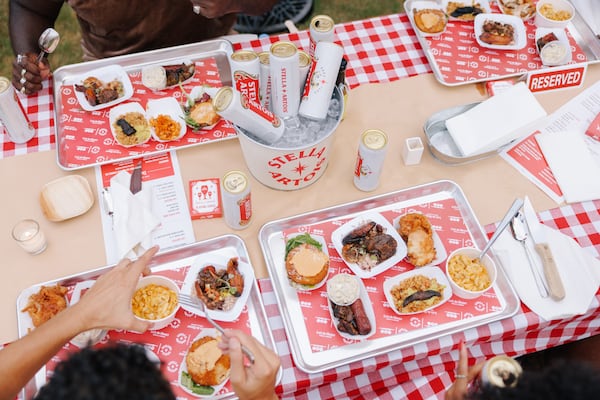 A spread of food from Black-owned restaurants and food businesses at the Luda's Cookout event, held August 14, 2024, in Atlanta's Piedmont Park.