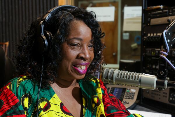 WCLK Midday Jazz host Gwen Redding, aka RivaBlue, speaks on air at their station on the lower level of the Woodruff Library on Clark Atlnata’s campus, Thursday, January 25, 2024, in Atlanta. WCLK is celebrating the 50th anniversary of Atlanta's jazz station. (Jason Getz / jason.getz@ajc.com)